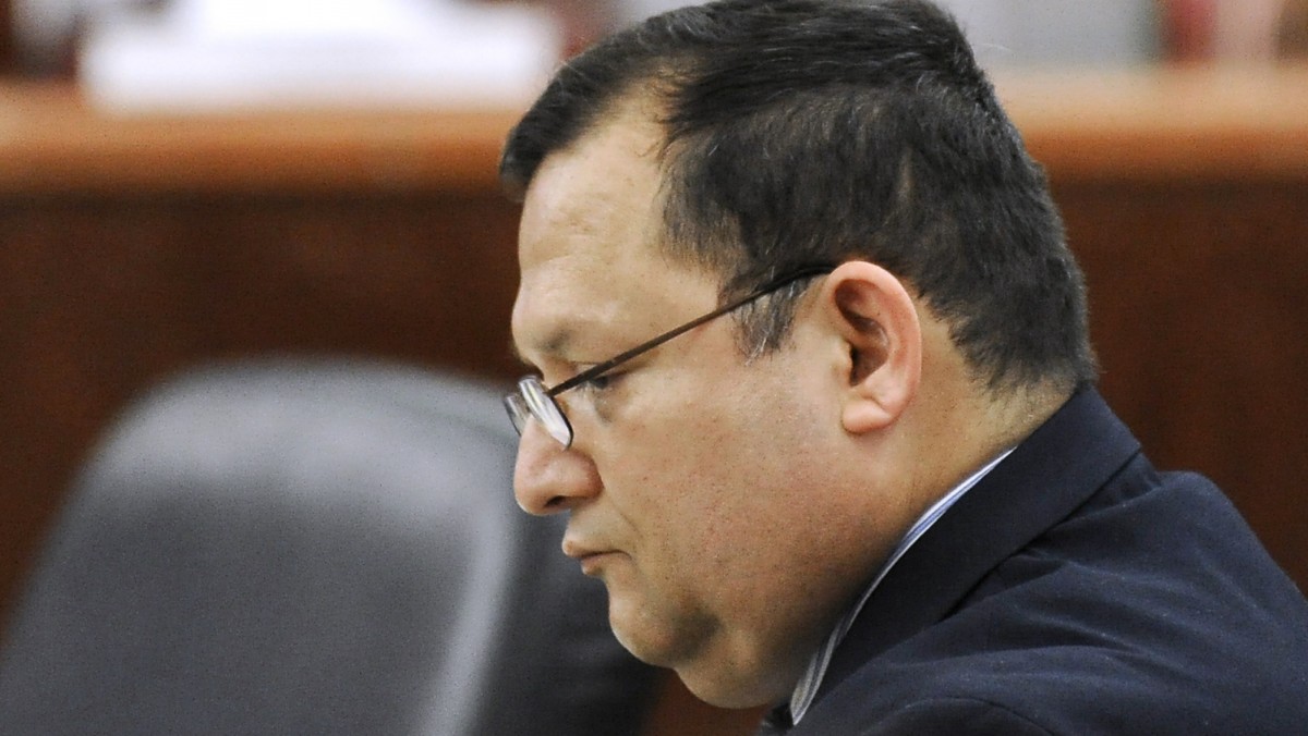 Raul Rodriguez sits in a Houston courtroom Monday, June 11, 2012. Rodriguez is charged with murder in a triple shooting in 2010 that left one man dead and two others injured during a dispute over the neighbor's loud party. The retired Houston-area firefighter told a police dispatcher by phone that he feared for his life and was "standing his ground." (AP Photo/Pat Sullivan)