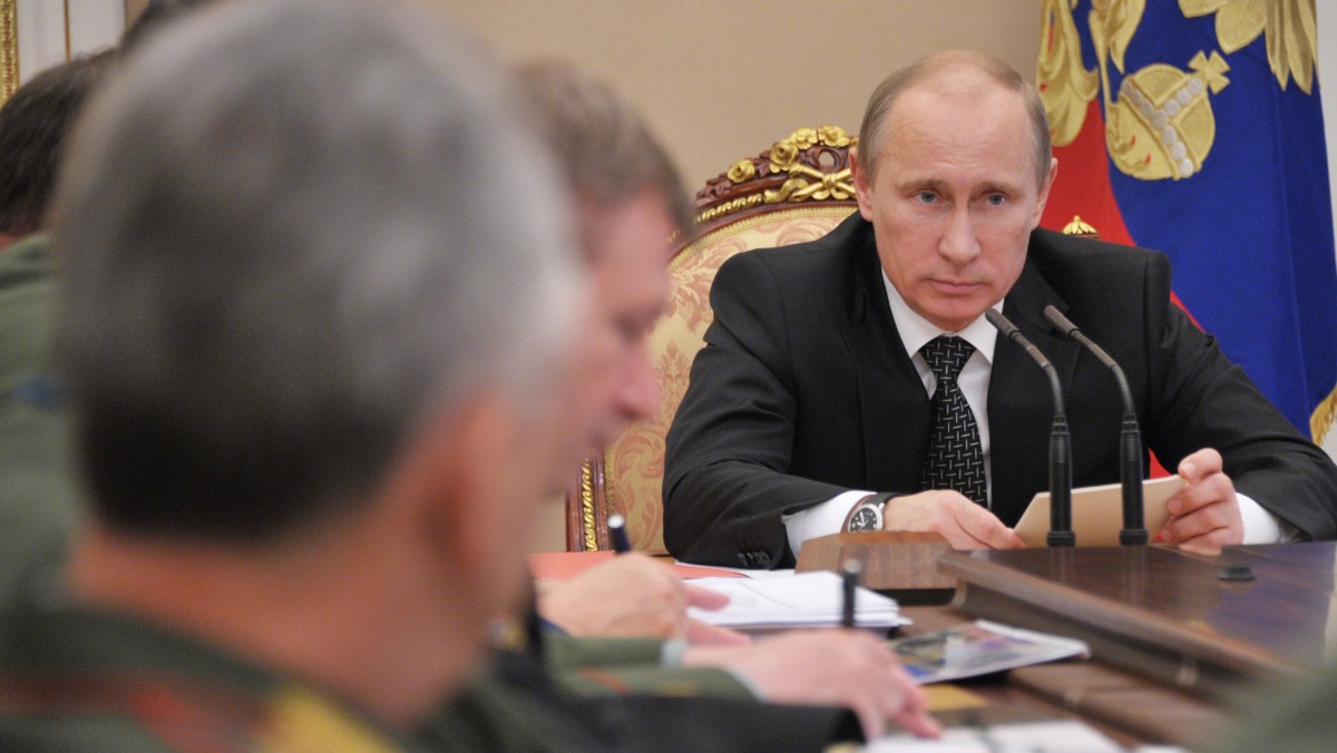 Russian President Vladimir Putin, right, speaks during a meeting with the top military brass in Moscow on Wednesday, May 30, 2012. (AP Photo/RIA Novosti, Alexei Nikolsky, Government Press Service)