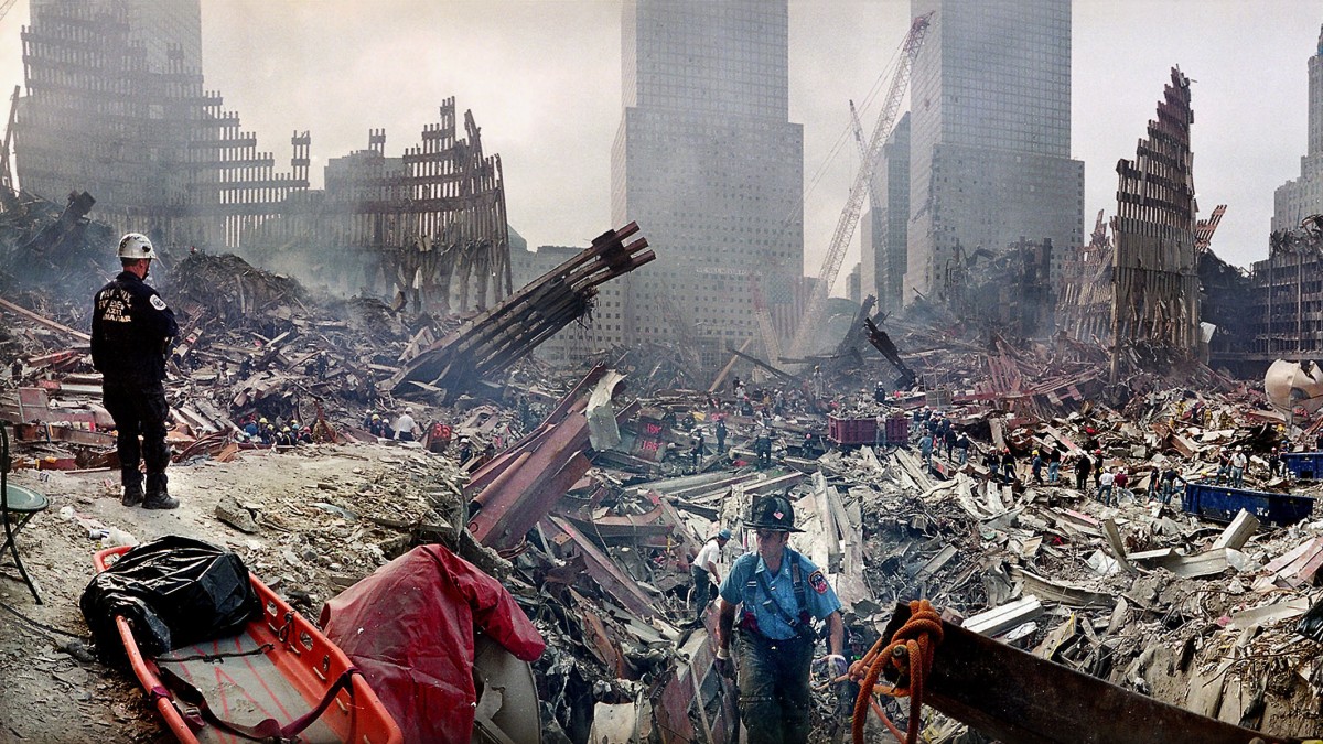 In this Monday, Sept. 24, 2001 file photo, rescue workers examine the site of the Sept. 11, 2001 World Trade Center terrorist attacks in New York. (AP Photo/Ted S. Warren, Pool, File)