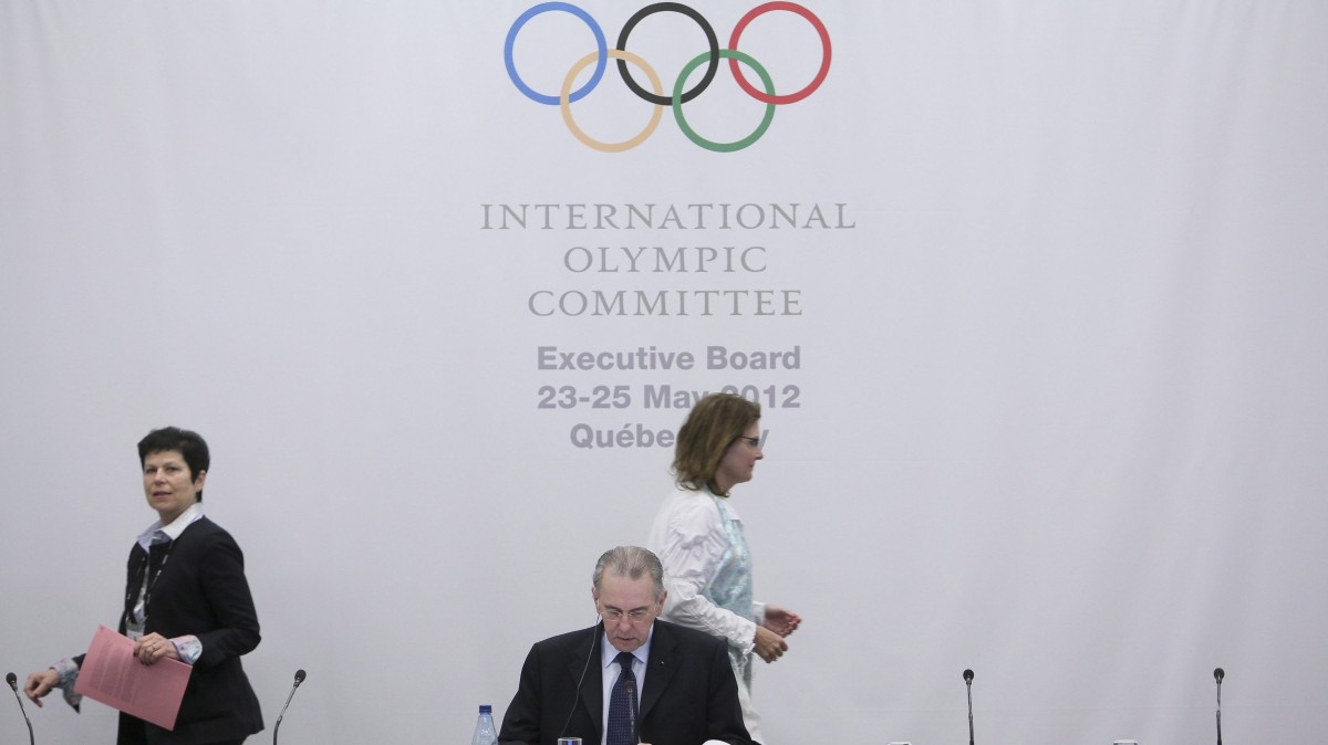 International Olympic Committee president Jacques Rogge looks at his notes before the IOC Executive Board meeting at the SportAccord conference in Quebec City Thursday, May 24, 2012. (AP Photo/The Canadian Press, Francis Vachon)