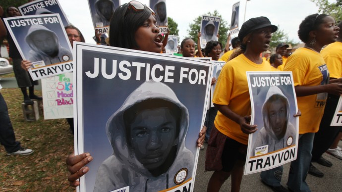 Candra Bryant, Vero Beach, chants for justice, at the beginning of a march from Crooms Academy to the Sanford Police Station for a rally in support of Trayvon Martin, the teen shot by George Zimmereman while on Neighborhood Watch patrol, Saturday, March 31, 2012 in Sanford, Fla. (AP Photo/Julie Fletcher)