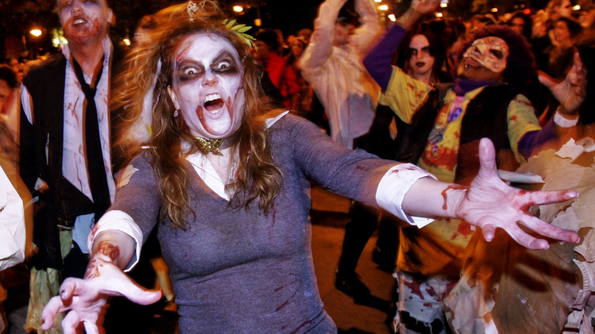 A woman dressed as a zombie marches in Greenwich Village's Halloween parade, Friday, Oct. 31, 2008 in New York. (AP Photo/Dima Gavrysh)