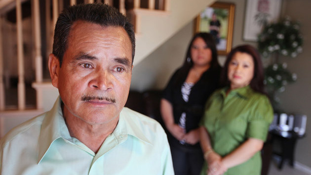Francisco Reynoso, with his wife Silvia and daughter Evelyn in the background, co-signed for his son's student loans. When his son Freddy was killed in a car accident after graduating from college, Reynoso not only had to deal with his grief but also with debt collectors constantly calling him to repay his son's loans. (J. Emilio Flores for ProPublica)