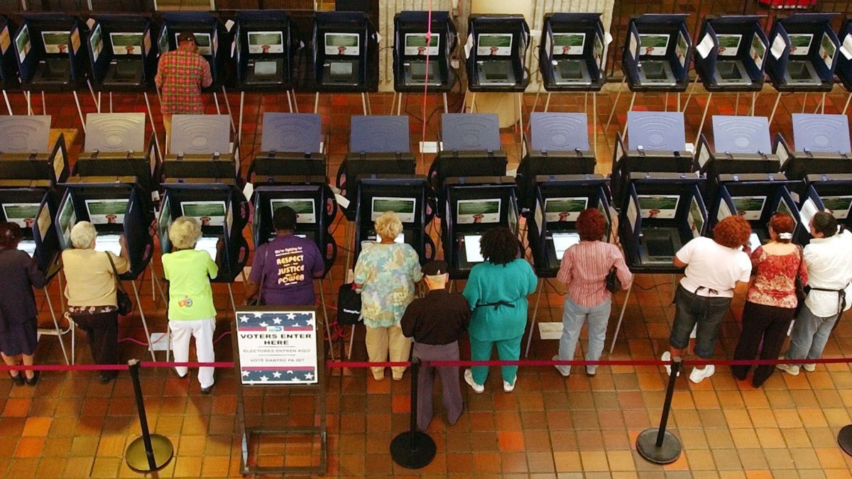 Voters cast their ballots electronically in a downtown Miami government building. (AP Photo/J.Pat Carter)