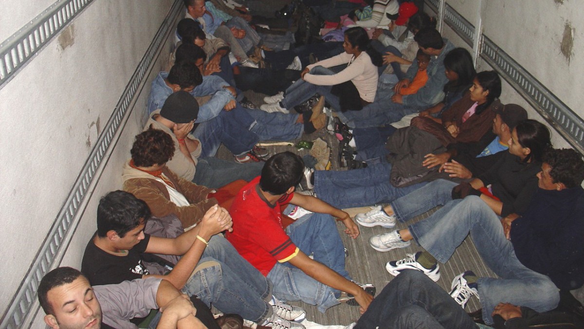 This image released by the U.S. Customs and Border Protection on Wednesday, Feb. 21, 2007, shows Brazilian nationals inside a tractor-trailer after they were discovered at the Falfurrias, Texas, Border Patrol checkpoint, Feb. 18, 2007. (AP Photo/U.S. Customs and Border Protection)