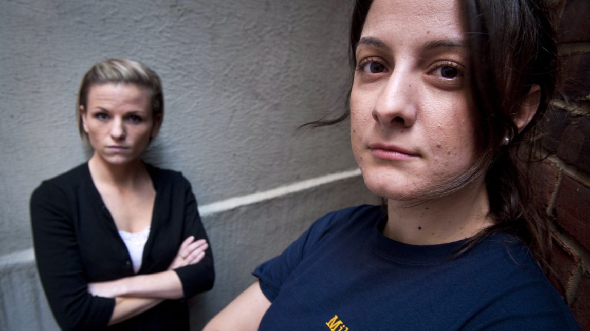 Veterans Kori Cioca, 25, of Wilmington, Ohio, left, and Panayiota Bertzikis, 29, of Somerville, Mass., both assaulted and raped while serving in the U.S. Coast Guard, meet at their attorney's office in Washington, Sunday, Feb. 13, 2011. (AP Photo/Cliff Owen)