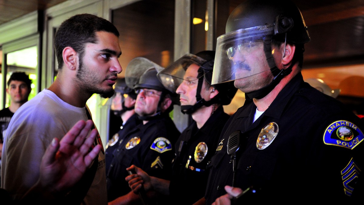 Demonstrators gather on the steps of Anaheim City Hall Tuesday, July 24, 2012, to protest the death of Manuel Diaz, 25, who died as a result of gunshot wounds sustained during a police pursuit by the Anaheim Police Department last Saturday. (AP Photo/The Orange County Register,Stuart Palley )