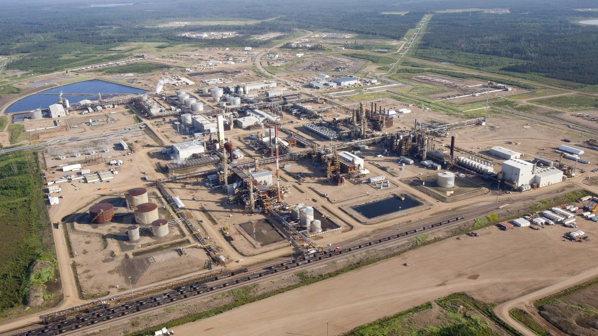 In this photo taken Tuesday, July 10, 2012, a Nexen oil sands facility seen from a helicopter near Fort McMurray, Alberta, Canada. Nexen is being acquired by China National Offshore Oil Co. in a US$15-billion deal that, if successful, will be China's largest ever overseas acquisition. (AP Photo/The Canadian Press, Jeff McIntosh)