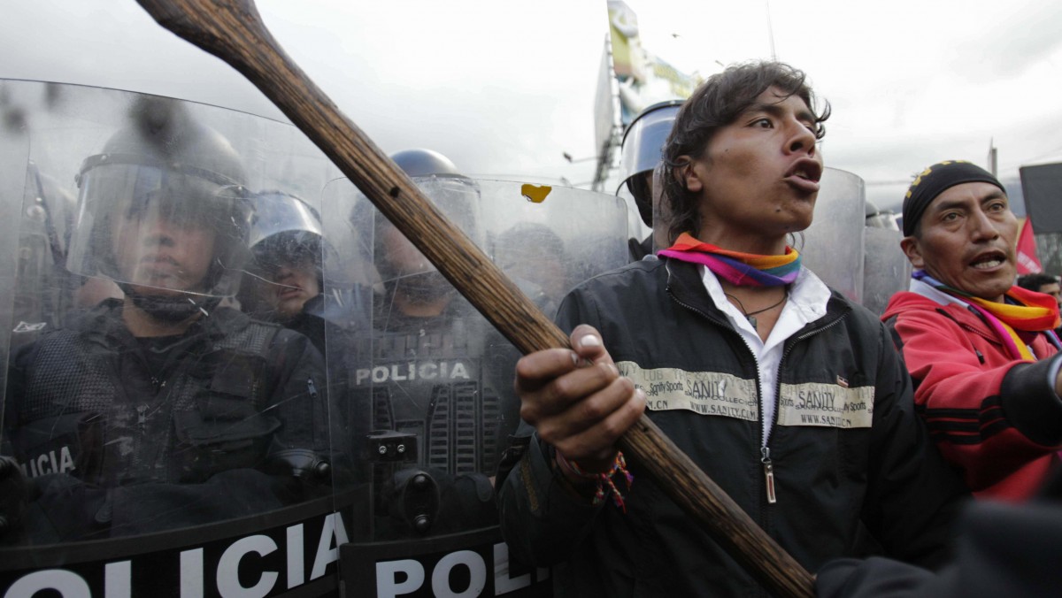 Protesters clash with police as they try to enter the National Assembly in Quito, Ecuador, Thursday March 22, 2012. (AP Photo/Dolores Ochoa)