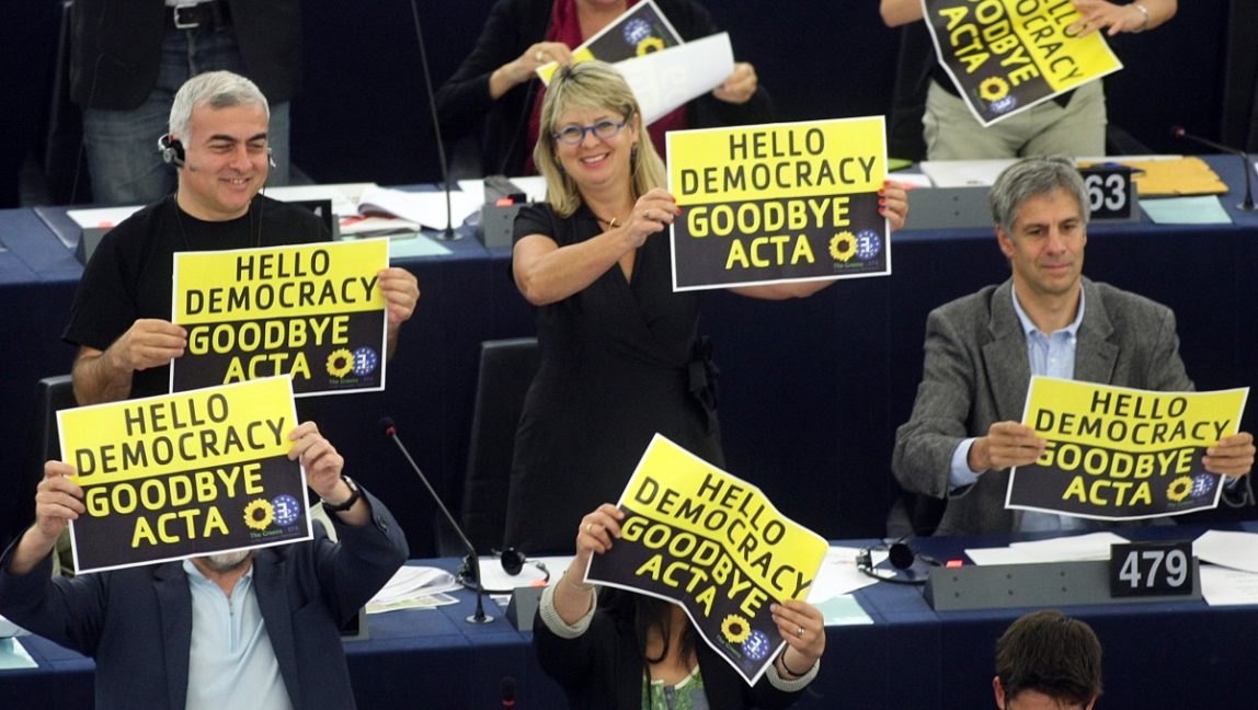 Green Party members of the European parliament demonstrate against the ACTA project (Anti-Counterfeiting Trade Agreement) during the vote Wednesday, July 4, 2012 at the European Parliament in Strasbourg, eastern France. (AP Photo/Christian Lutz)