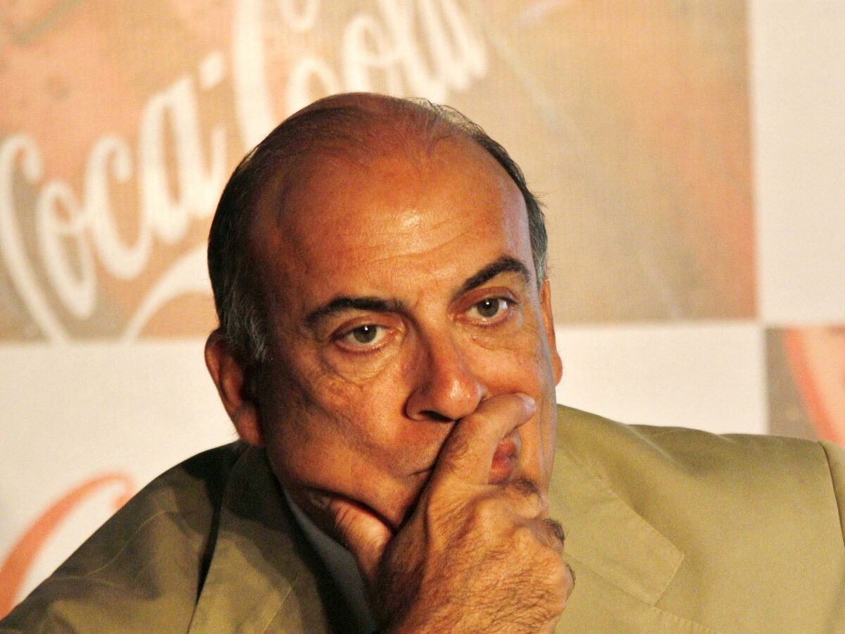 Muhtar Kent, left, Chairman and CEO of The Coca-Cola Company watches during a meeting in New Delhi, India, Tuesday, June 26, 2012. (AP Photo/Manish Swarup)