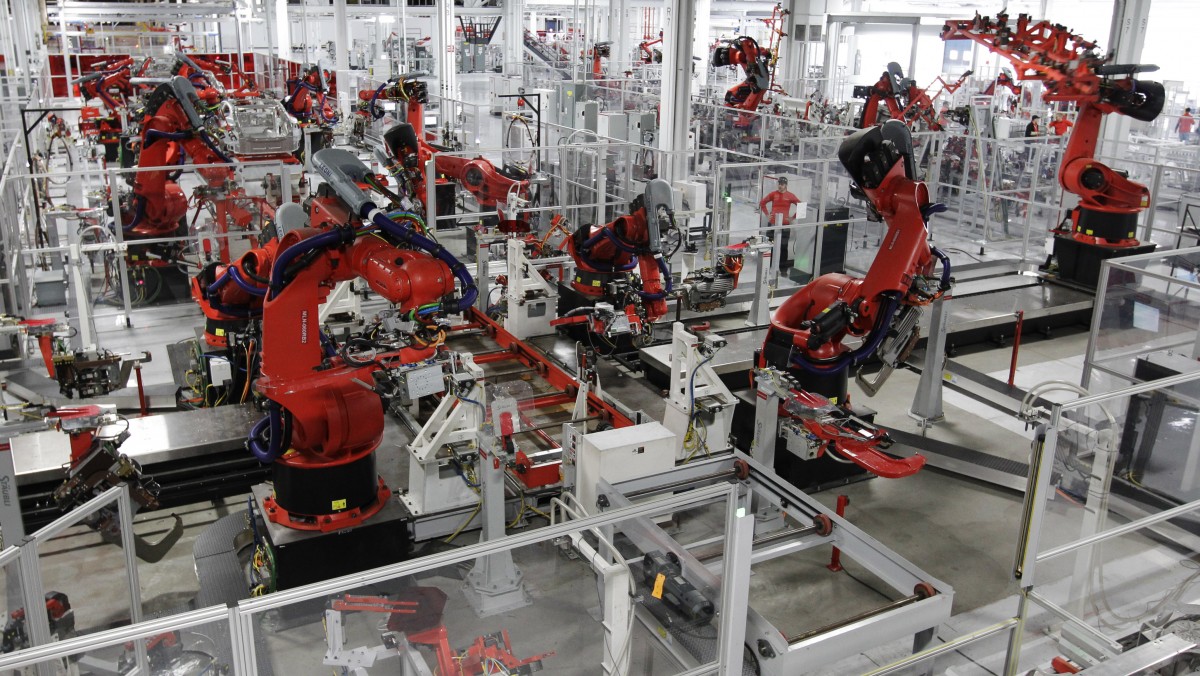 Robots assemble a Tesla Model S at the Tesla factory in Fremont, Calif. U.S. (AP Photo/Paul Sakuma, File)