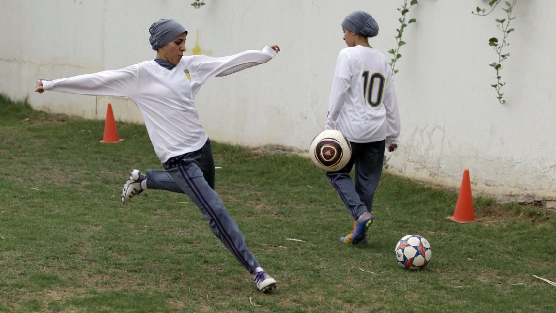 In this May 21, 2012 photo, members of a Saudi female soccer team, including team captain Rawh Abdullah, left, practice at a secret location in Riyadh, Saudi Arabia. (AP Photo/Hassan Ammar)