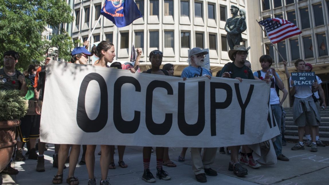 Occupy activists march through the streets of Philadelphia, PA July, 2, 2012. (Mannie Garcia/MintPress)