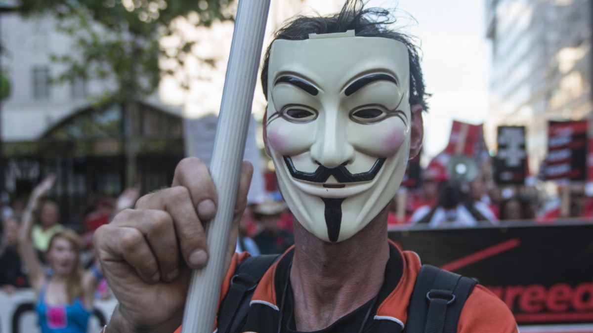 A man wearing a Guy Fawkes mask join the marches in Philadelphia, PA July 2, 2012. (Mannie Garcia/MintPress)