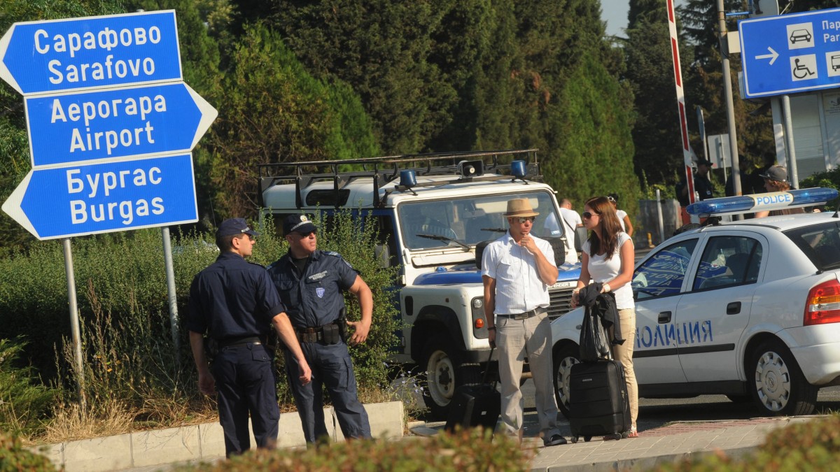 In this Thursday, July 19, 2012 file photo, foreign tourists wait to pass as police block the entrance of Burgas airport, Bulgaria, a day after a deadly suicide attack on a bus full of Israeli vacationers. Israel's prime minister said Sunday, July 22, 2012 that his country is on alert for plots to kill more of its citizens overseas, after speculation that last week's deadly bombing of a tour bus in Bulgaria was a rehearsal for a spectacular attack on Israel's Olympics team. (AP Photo, File)