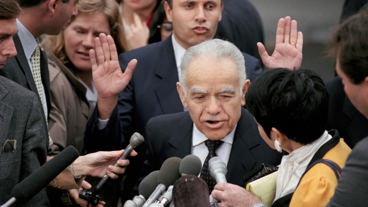 Israeli Prime Minister Yitzhak Shamir asks reporters to back off as Shamir leaves a meeting with President Bush White House. Nov. 22, 1991. Barry Thumma | AP