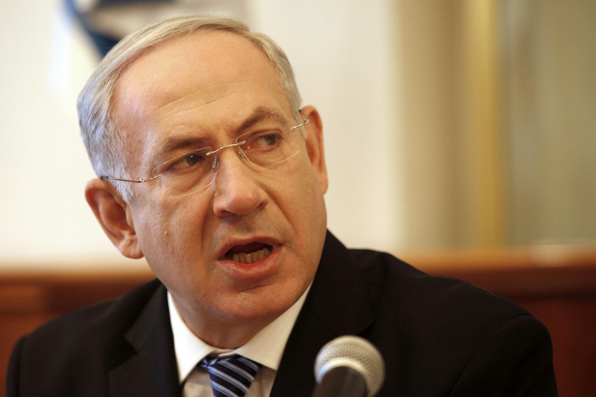 Israeli Prime Minister Benjamin Netanyahu opens the weekly cabinet meeting at his office in Jerusalem, Sunday, July 22, 2012. (AP Photo/Gali Tbbon, Pool)