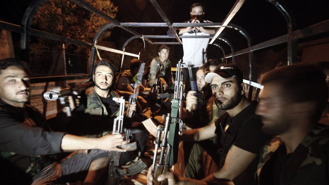 In this Sunday, July 29, 2012 photo, Free Syrian Army soldiers are seen at the border town of Azaz, some 20 miles (32 kilometers) north of Aleppo, Syria. (AP Photo/Turkpix)