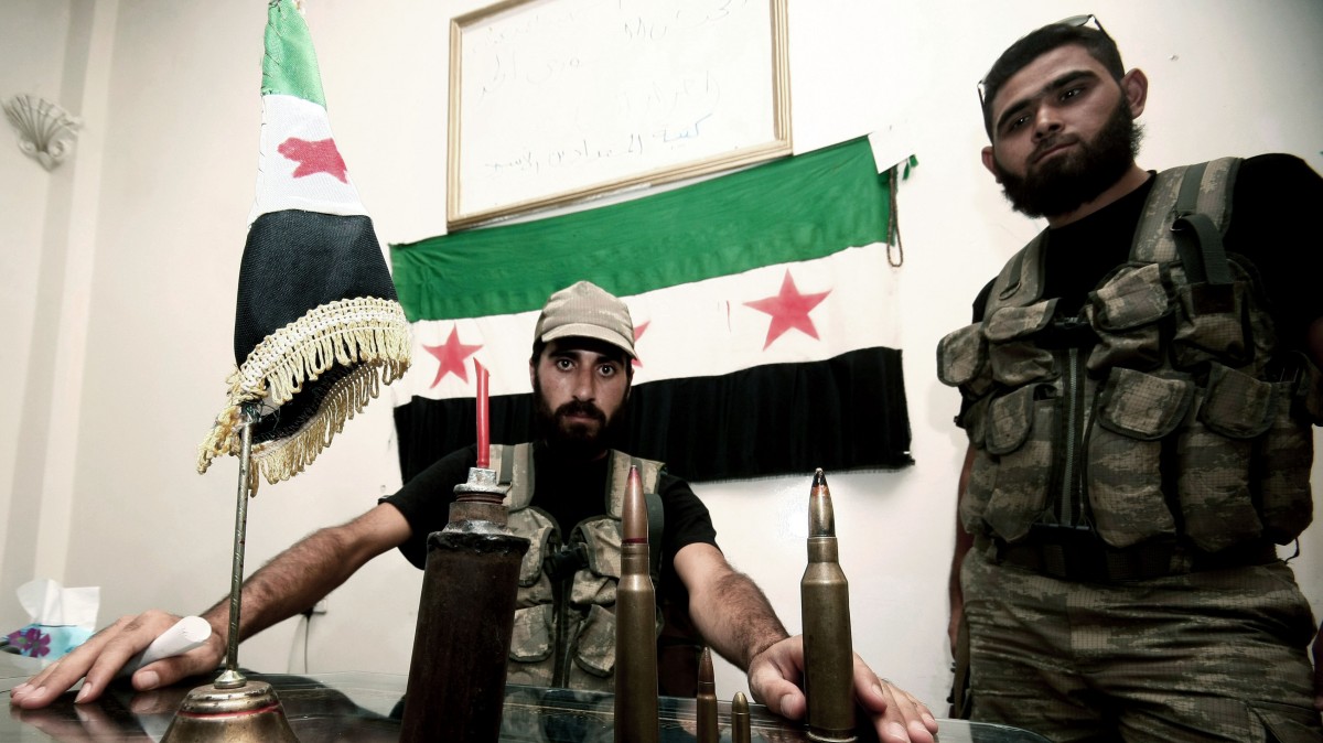 In this Tuesday, July 24, 2012 photo, Free Syrian Army soldiers are seen at the border town of Azaz, some 20 miles (32 kilometers) north of Aleppo, Syria. (AP Photo/Turkpix)