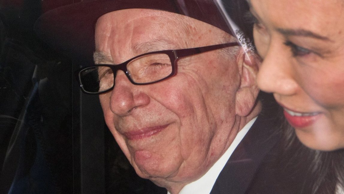 In this April 26, 2012 file photo, News Corp. chairman Rupert Murdoch leaves the High Court in London. (AP Photo/Sang Tan, File)