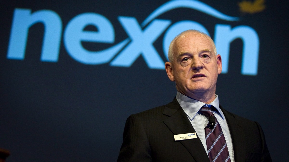 In this April 25, 2012 photo, Nexen chief executive Kevin Reinhart addresses the company's annual meeting in Calgary, Alberta. Oil and gas producer Nexen Inc. has agreed to be acquired by China National Offshore Oil Company for US$15.1 billion cash. (AP Photo/The Canadian Press, Jeff McIntosh)