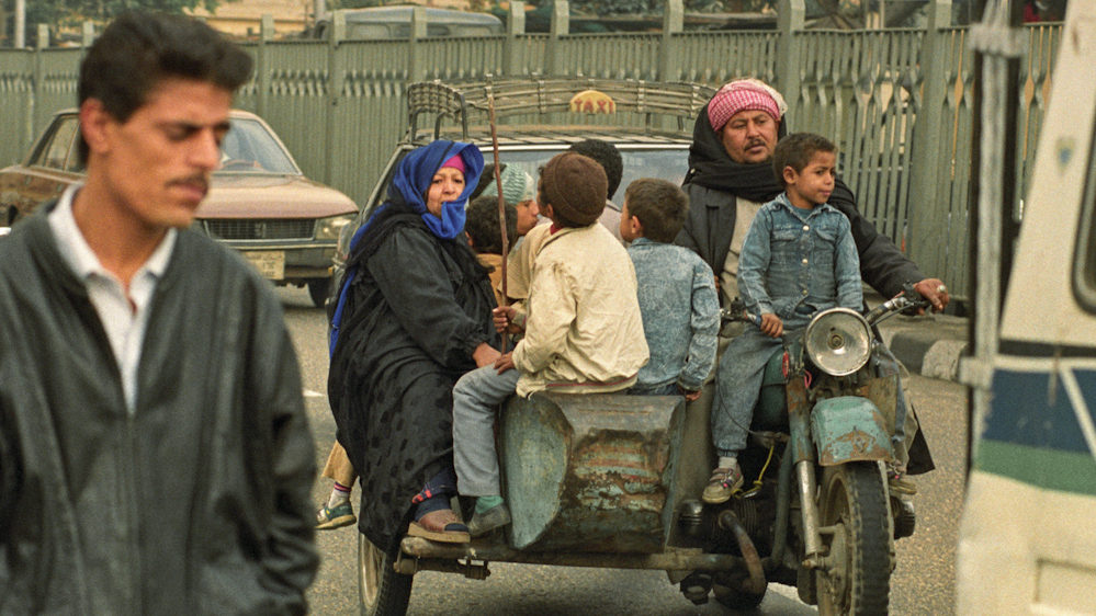 A family packed on to a motorcycle is an everyday occurrence in Cairo, Egypt. A scene like this would never be witnessed in a place like the United States. (Ph. Norbert Schiller)