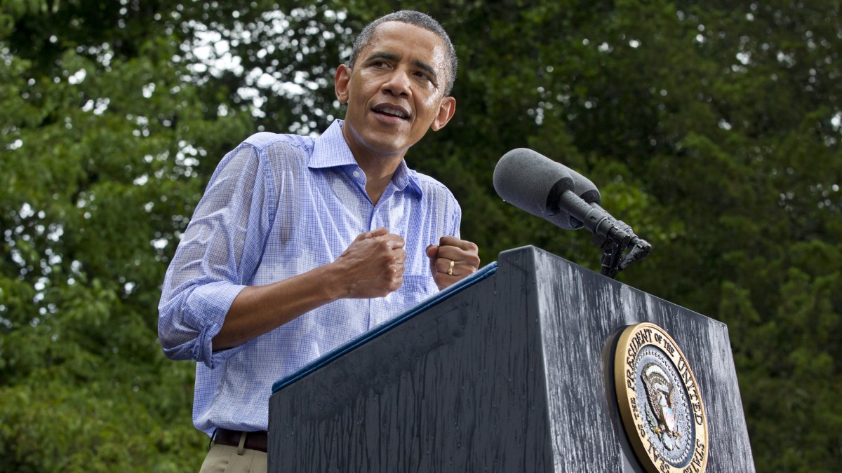President Barack Obama holds a campaign rally in a downpour at the historic Walkerton Tavern & Gardens in Glen Allen, Va., near Richmond, Va., Saturday, July 14, 2012. (AP Photo/J. Scott Applewhite)