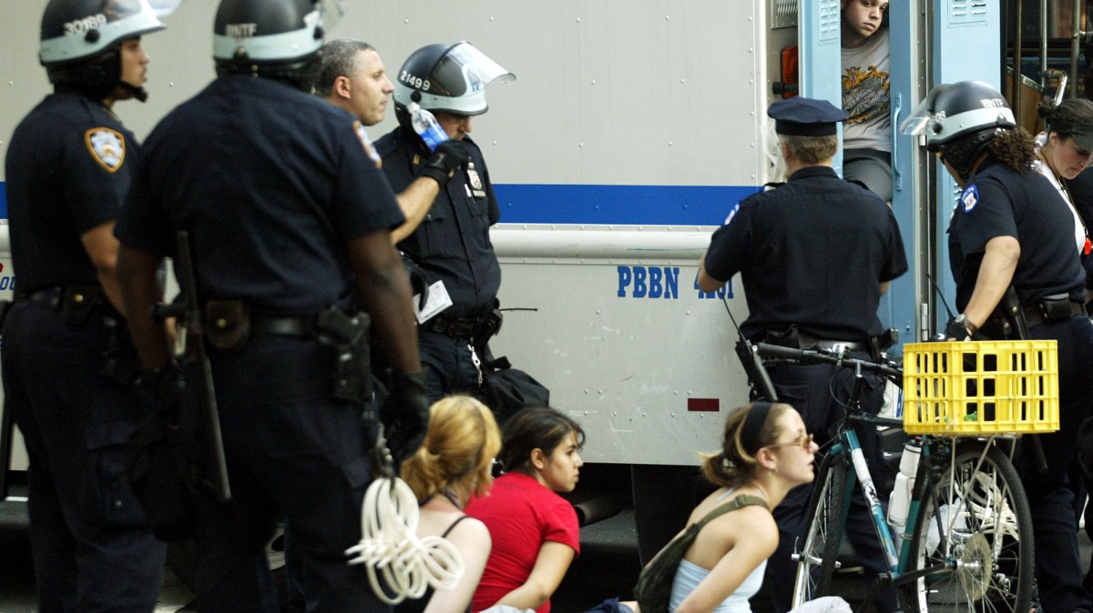Protesters are arrested by New York Police officers Tuesday, Aug. 31, 2004 at the intersection of Broadway and 40th St. in New York. (AP Photo/Ted S. Warren)