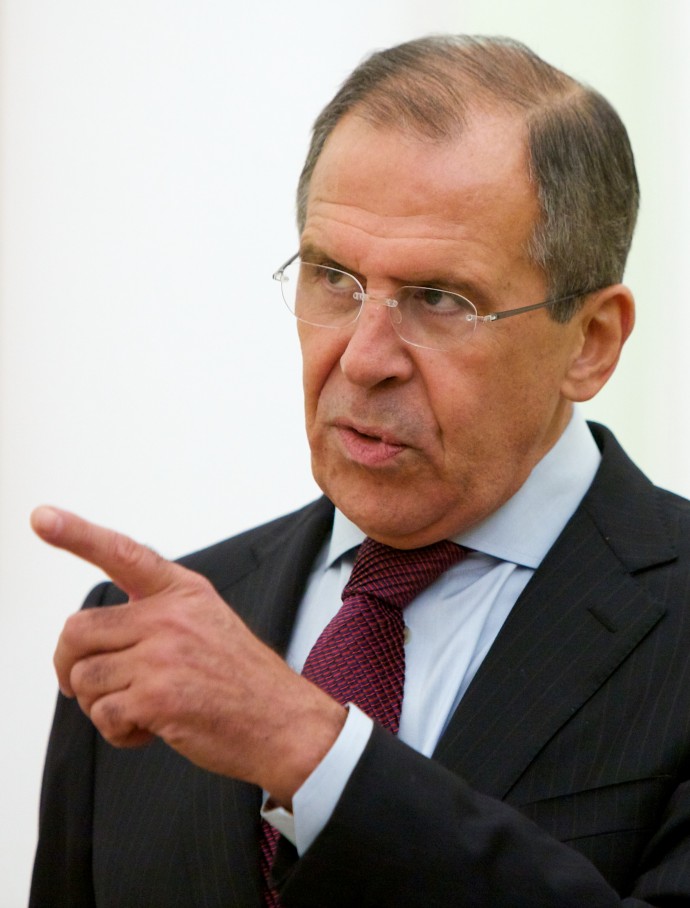 Russian Foreign Minister Sergey Lavrov points as he waits for the meeting with Russian President Vladimir Putin and United Nations special envoy Kofi Annan in Moscow,  Russia, Tuesday, July 17, 2012. (AP Photo/Alexander Zemlianichenko)