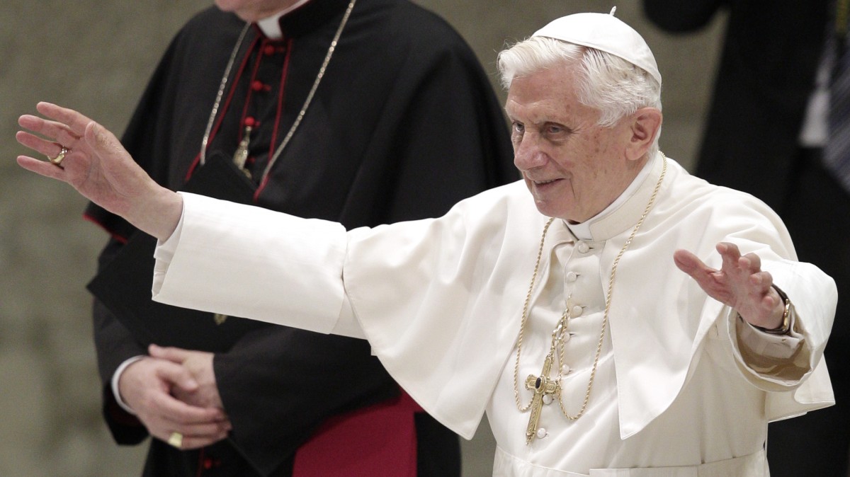 Pope Benedict XVI waves as he arrives for an audience to newly appointed archbishops, the day after they received the pallium, a woolen shawl symbolizing their bond to the pope, at the Paul VI hall, Vatican, Saturday, June 30, 2012. (AP Photo/Riccardo De Luca)
