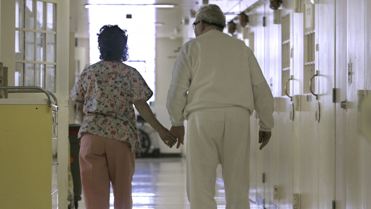 Debbie Coluter, a certified nurses assistant, assists an elderly patient with Alzheimers Disease. (AP Photo/Rich Pedroncelli)