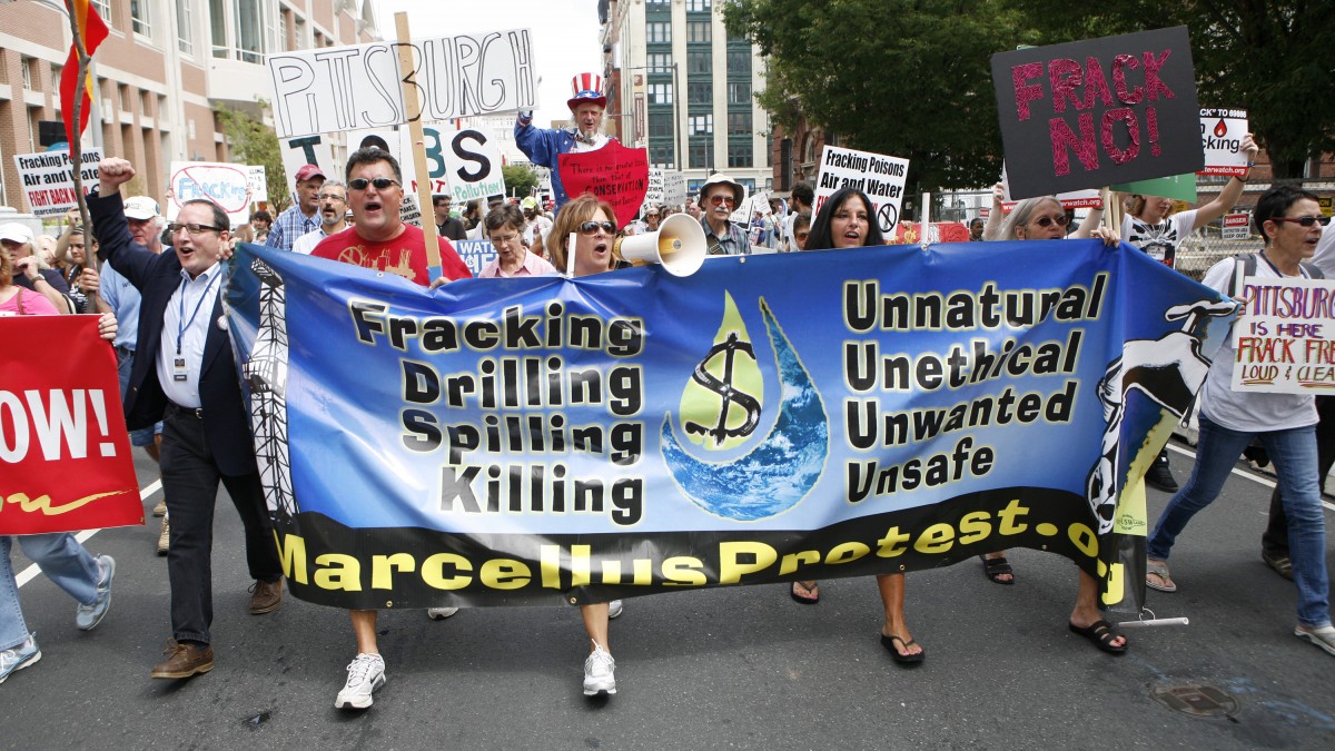 Activists and homeowners march following a protest against hydraulic gas drilling, or "fracking." (AP Photo/Mark Stehle)