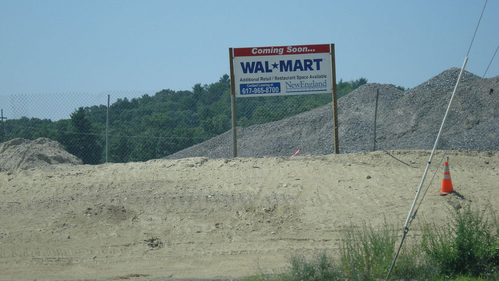 A sign shows the future home of a Wal-Mart store. In California, protesters demonstrated against the opening of a Wal-Mart store in Los Angeles. (Photo by Buck/bucklava via Flikr)