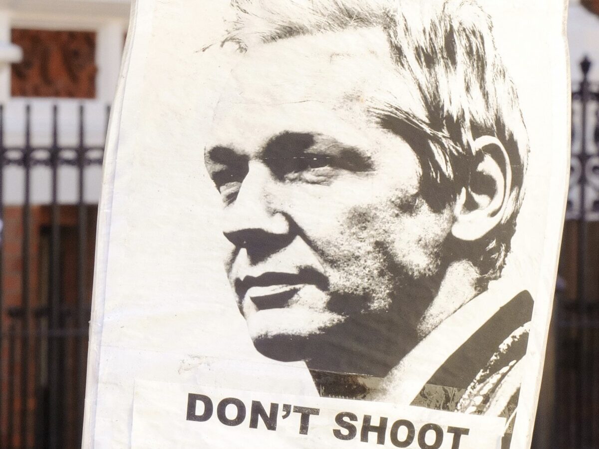 A pro-Julian Assange placard is seen outside the Embassy of Ecuador, in central London, Saturday August 18, 2012, where Wikileaks founder Julian Assange is claiming asylum in an effort to avoid extradition to Sweden. (AP Photo / Dominic Lipinski/PA)