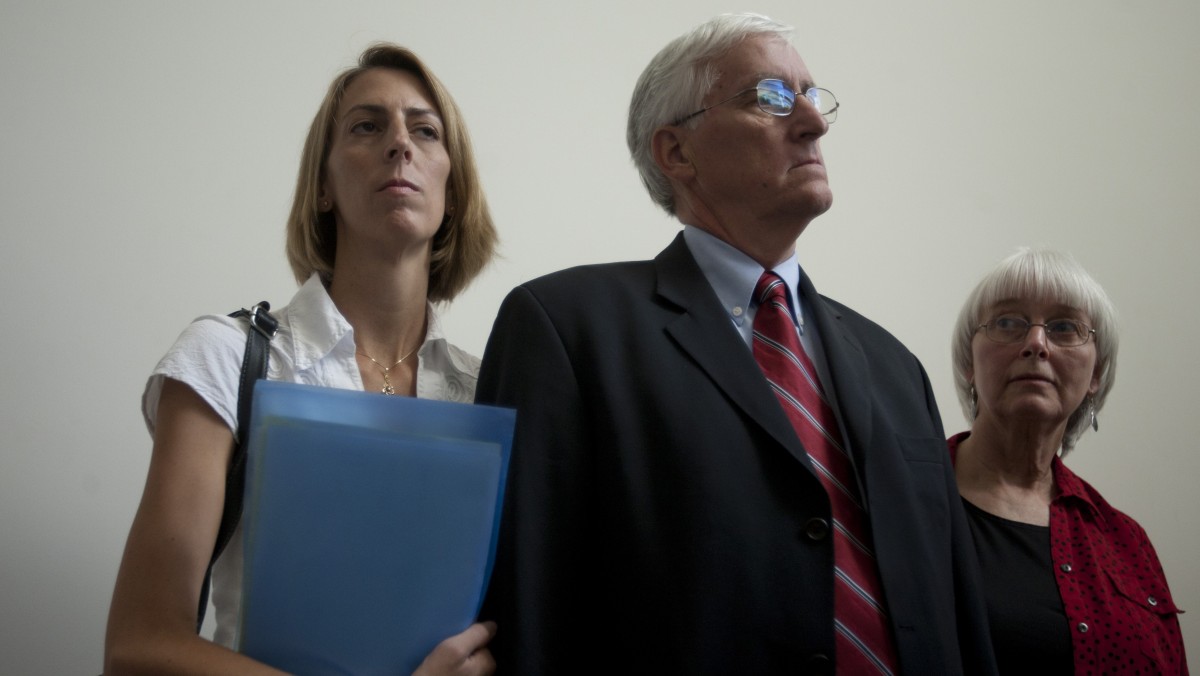 Cindy, right, and Craig Corrie, the parents of Rachel Corrie, a pro-Palestinian activist who was killed by an Israeli bulldozer in Gaza in 2003, stand together with their daughter Sarah after the district court's ruling in Haifa, Israel, Tuesday, Aug. 28, 2012. (AP Photo/Ariel Schalit)