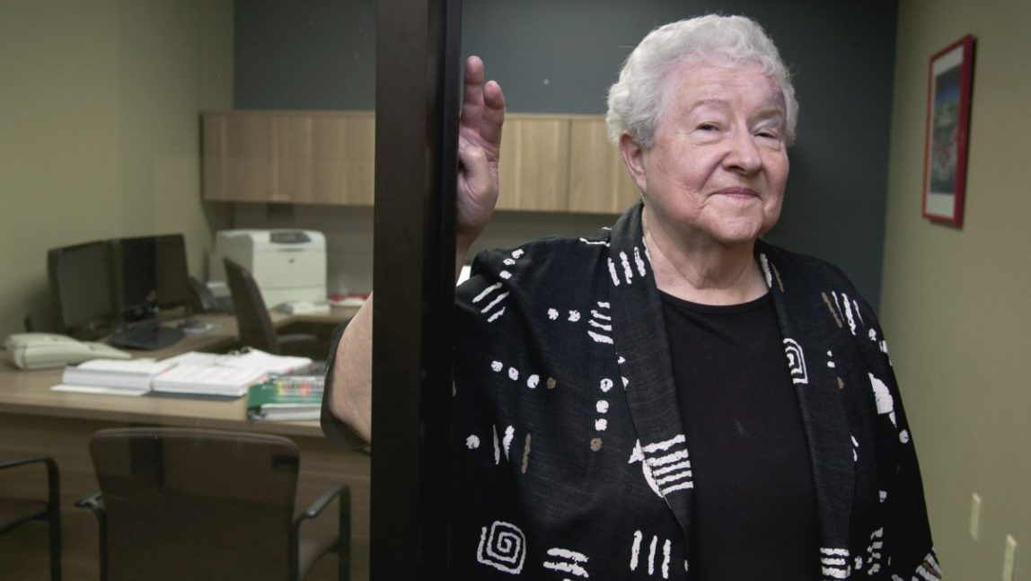 Janice Durflinger poses for a photo at her workplace in Lincoln, Neb., Wednesday, Aug. 1, 2012. Durflinger is still working at age 76, running computer software programs for a bank. Still, she worries that a higher retirement age would be tough on people with more physically demanding jobs. "No matter how much you exercise, age takes its toll," Durflinger said. (AP Photo/Nati Harnik)