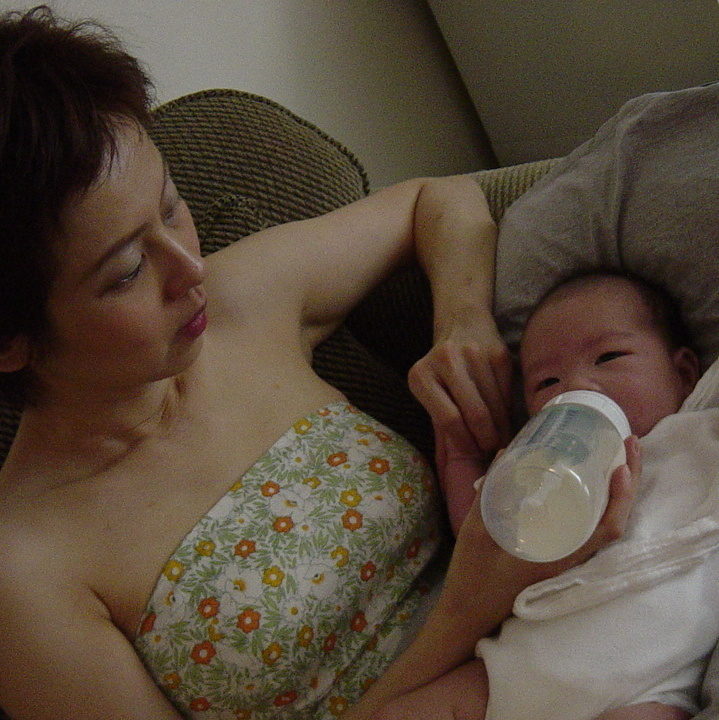 A mother feeds her child in August 2005. (Photo by misocrazy via Flikr)