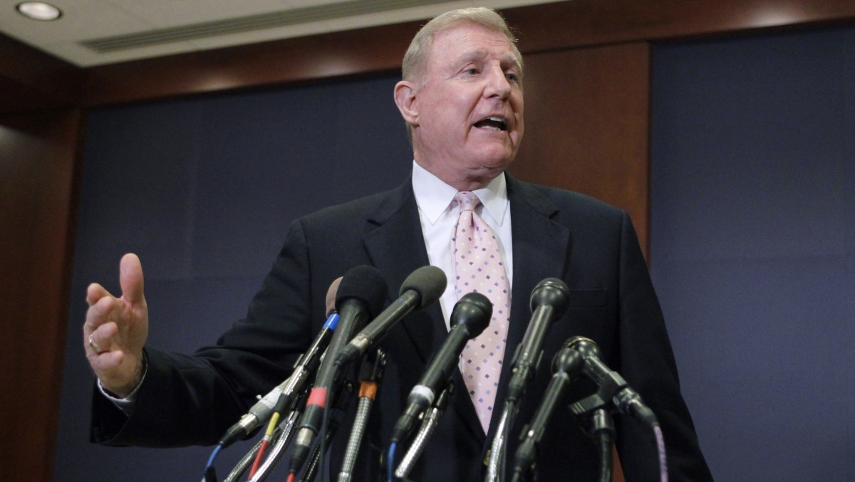 Rep. Dan Burton, R-Ind. gestures while speaking to reporters on Capitol Hill in Washington, Wednesday, March 30, 2011. (AP Photo/J. Scott Applewhite)