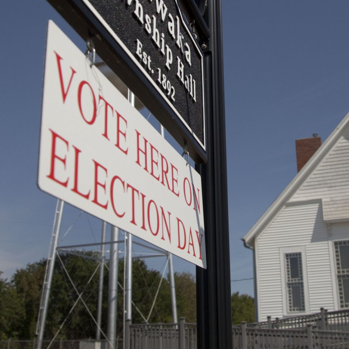 Primary election voters arrive at the Kanwaka Township Hall near Lawrence, Kan., Tuesday, Aug. 7, 2012. (AP Photo/Orlin Wagner)