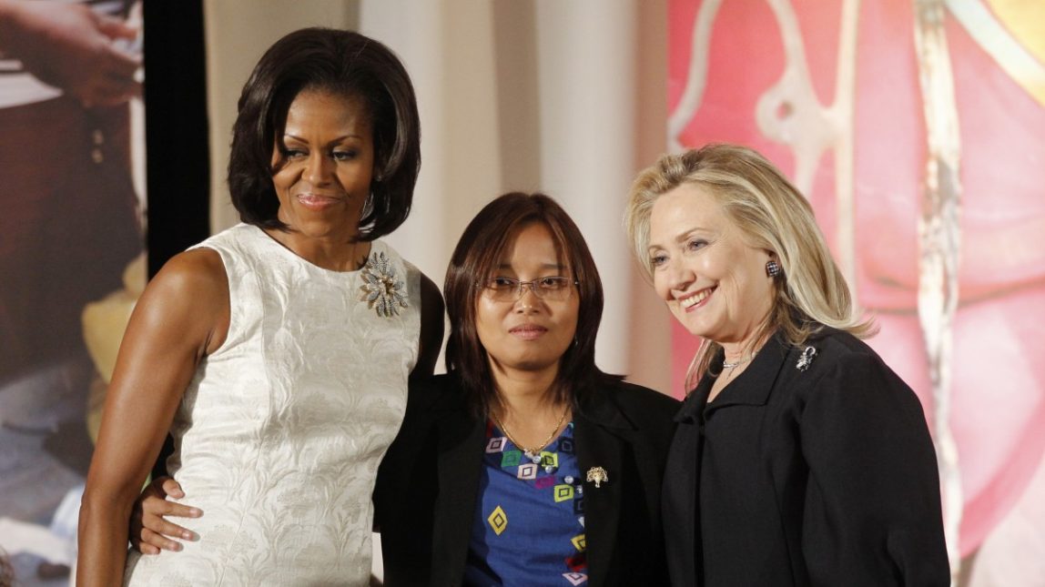 Secretary of State Hillary Rodham Clinton and first lady Michelle Obama present the 2012 International Women of Courage Award to former political prisoner Zin Mar Aung of Myanmar, on the 101st Anniversary of International Women's Day, Thursday, March 8, 2012, at the State Department in Washington. (AP Photo/Charles Dharapak)