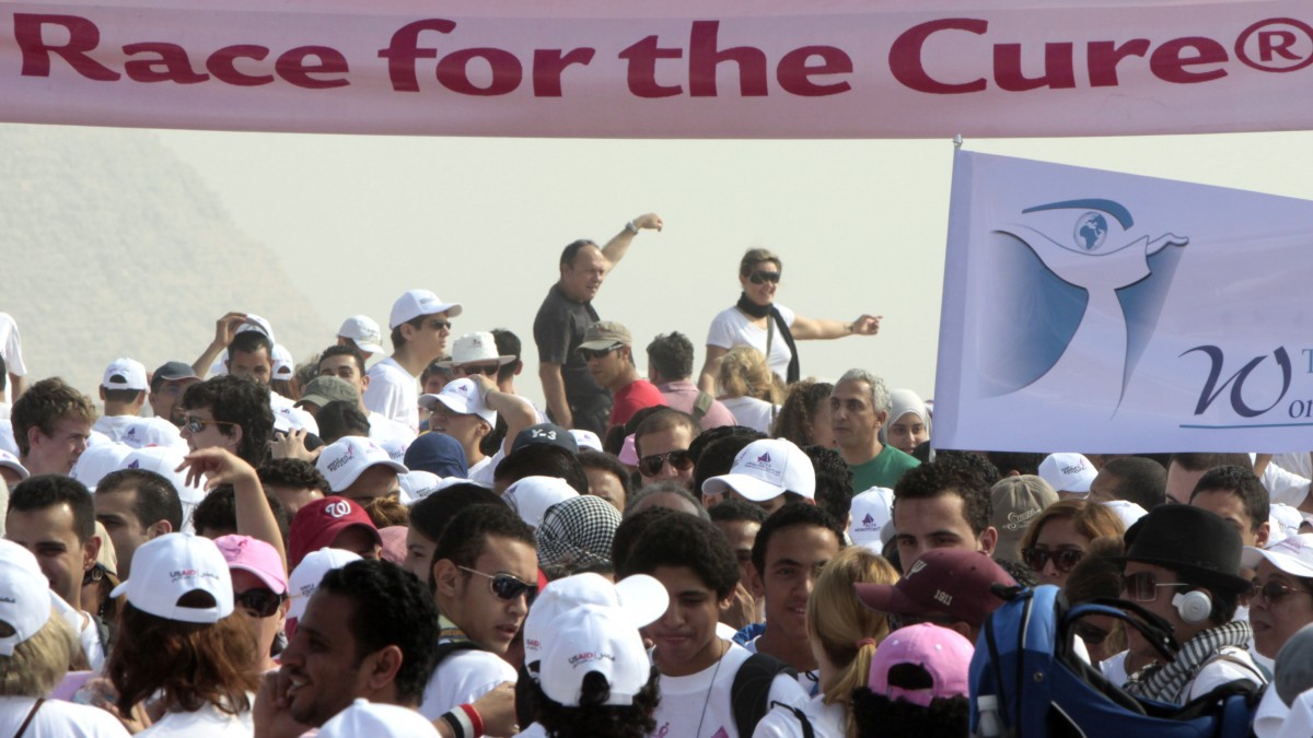 Runners prepare to start a mass public run for the Susan G. Komen Cure foundation, which is a worldwide organization to raise public awareness and search for a cure for breast cancer. (AP Photo/Amr Nabil)