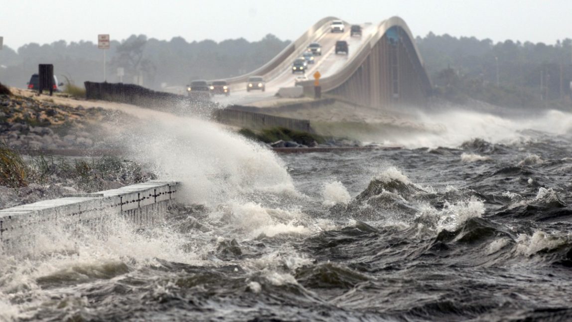 Waves from the Santa Rosa Sound crash over the Navarre Beach causeway in Navarre, Fla., Tuesday, Aug. 28, 2012 as Isaac approaches the Gulf Coast. (AP Photo/Northwest Florida Daily News, Nick Tomecek)