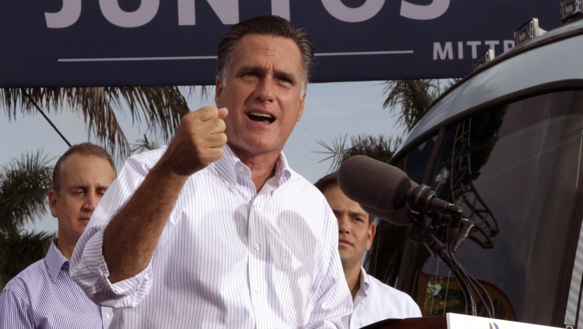 In this Aug. 13, 2012 file photo, Republican presidential candidate, former Massachusetts Gov. Mitt Romney, flanked by Rep. Mario Diaz-Balart, R-Fla., and Sen. Marco Rubio, R-Fla., speaks at a campaign event in Miami. (AP Photo/Mary Altaffer, File)
