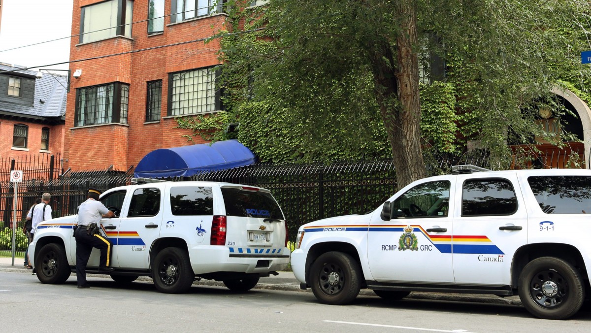 RCMP officers patrol outside the Iranian embassy in Ottawa, Friday Sept. 7, 2012. (AP Photo/The Canadian Press, Fred Chartrand)