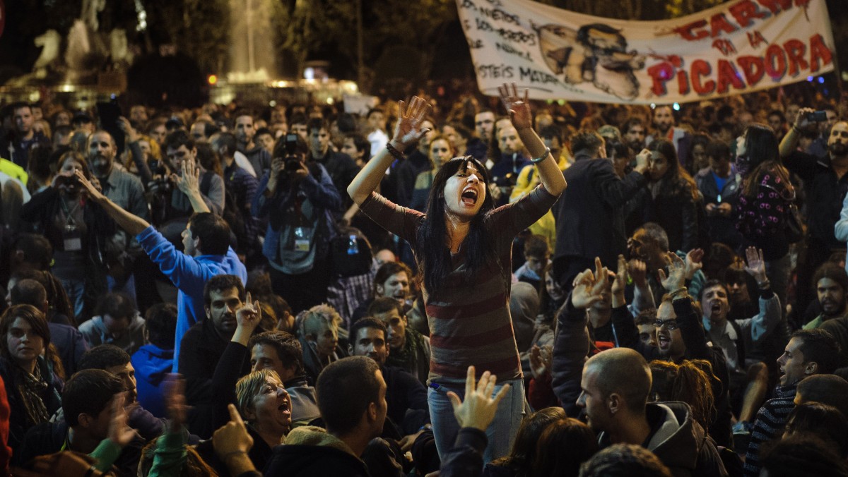 Protesters shout during a demonstration near the Spanish Parliament against austerity measures announced by the Spanish government in Madrid, Spain, Wednesday, Sept. 26, 2012. (AP Photo/Daniel Ochoa De Olza)