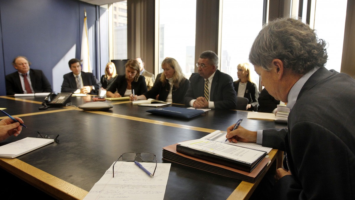 David Meier, right, special consul to the Governor appointed to lead the review of drug convictions which might have been compromised by a State Police drug testing lab, leads a meeting at the Department of Public Safety in Boston, Monday, Sept. 24, 2012. (AP Photo/Stephan Savoia)
