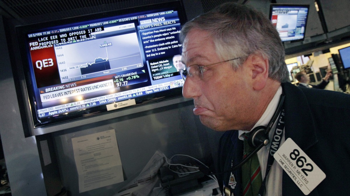 Trader Warren Meyers reacts to the announcement of the Federal Reserve as he watches a television screen on the floor of the New York Stock Exchange Thursday, Sept. 13, 2012. (AP Photo/Richard Drew)