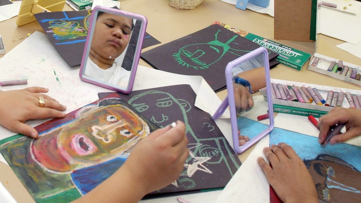 Fifth grade students draw self portraits during a Studio in a School class, Feb. 4, 2004. (AP Photo/Richard Drew)