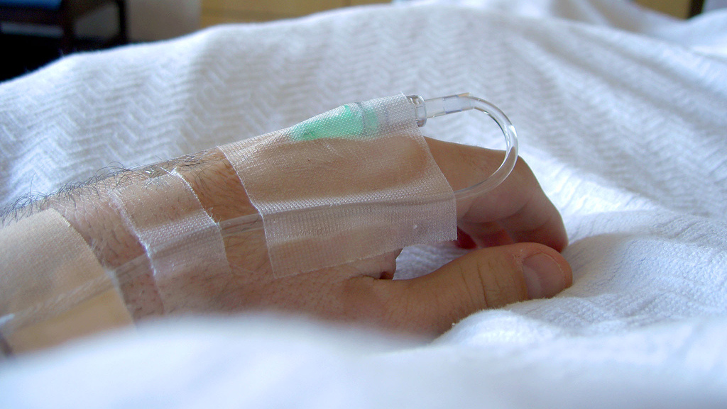 A patient lays in a hospital bed in Kansas City, Mo. (Photo by Tim Samoff via Flikr)